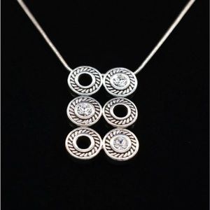 Silver with CZ.  Super cute piece!